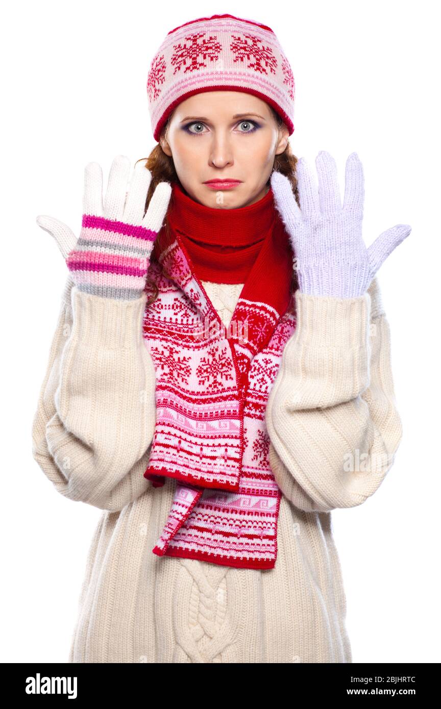 Sad woman in gloves of different colors  isolated on white background Stock Photo