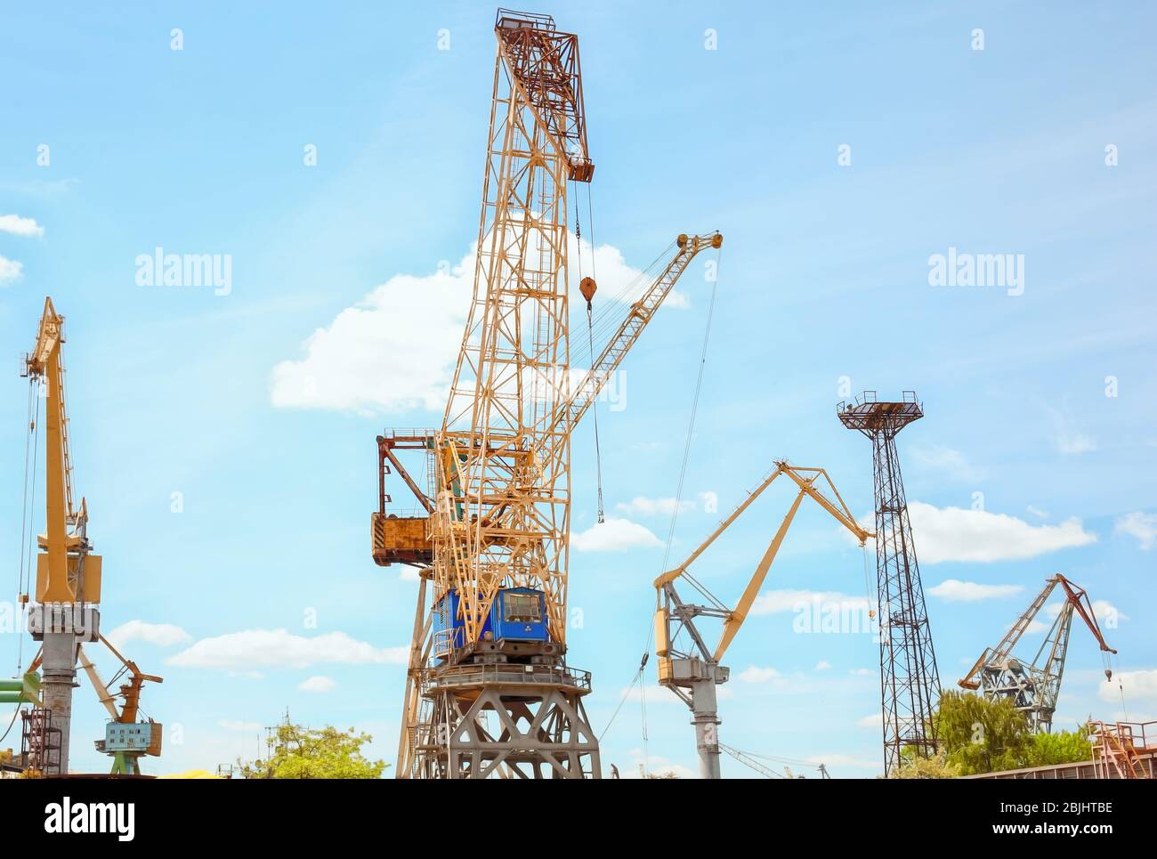 Hoisting cranes in shipyard Stock Photo