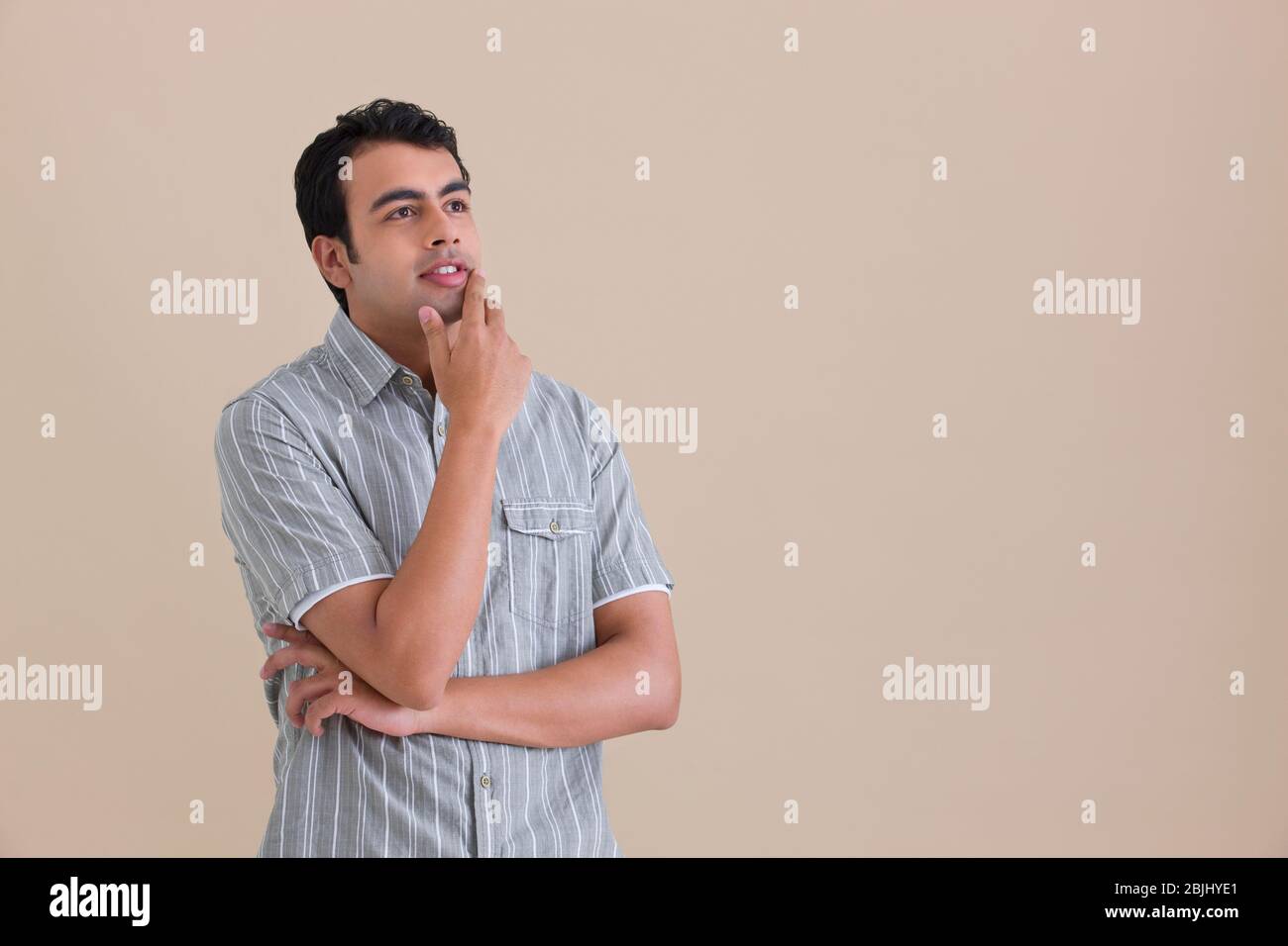 Young man thinking Stock Photo