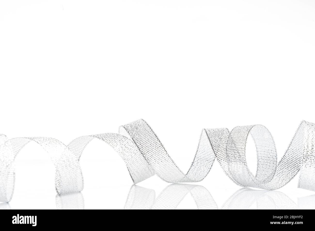 silver ribbon bow on white isolated background Stock Photo - Alamy