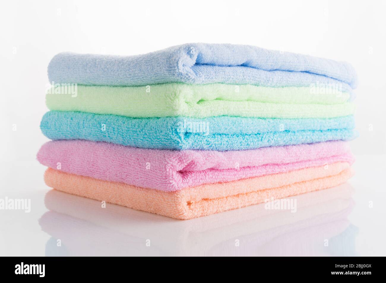 rainbow colored towels isolated on white Stock Photo Alamy