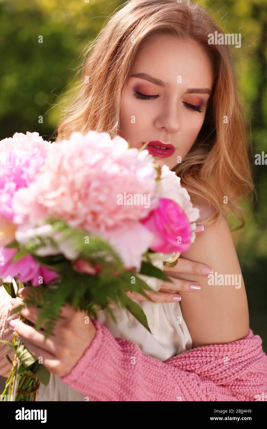 Woman with bouquet of peonies hi-res stock photography and images - Alamy
