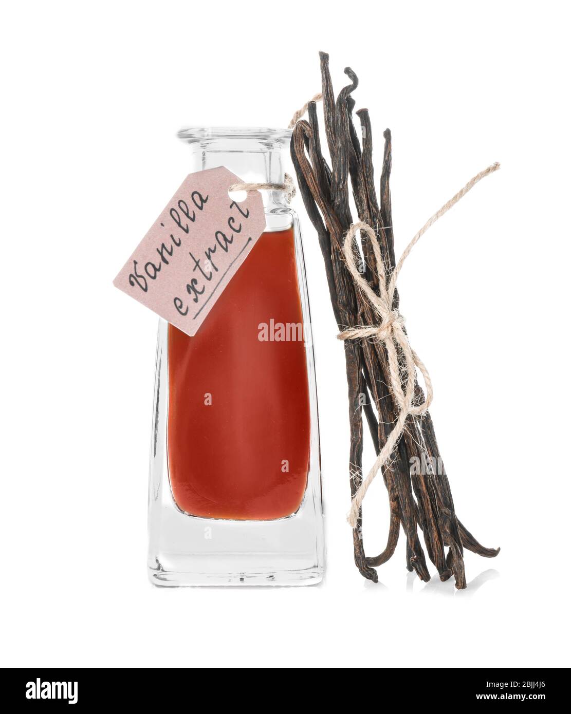 Bottle with vanilla extract and sticks on white background Stock Photo ...