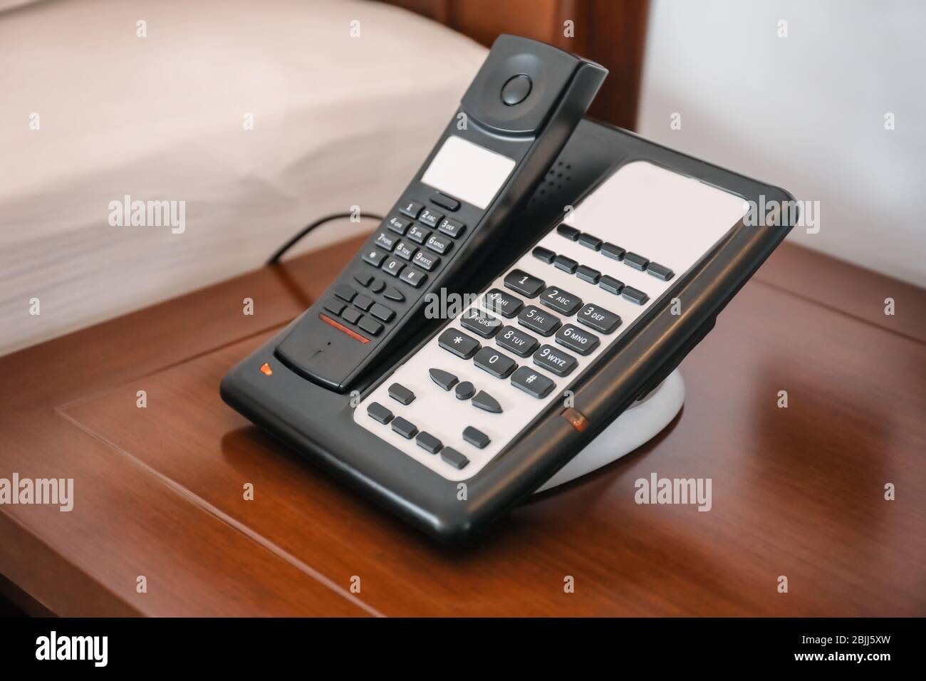 Modern telephone in hotel room Stock Photo Alamy