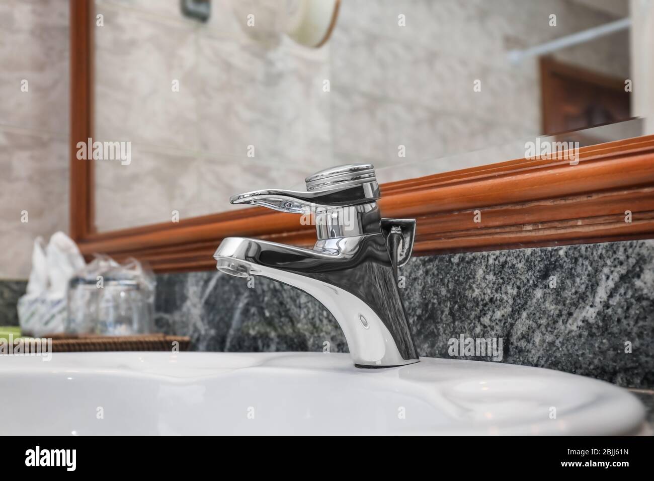 Water tap and sink in hotel bathroom Stock Photo - Alamy