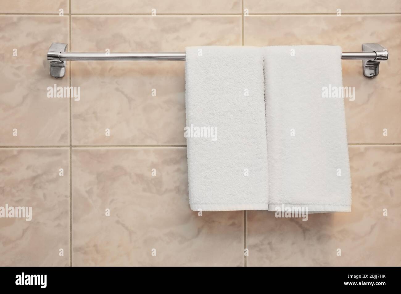 Dryer with towels in light modern bathroom Stock Photo