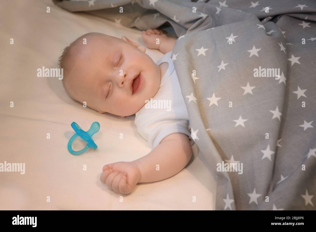 Adorable baby sleeping in cradle at home Stock Photo Alamy