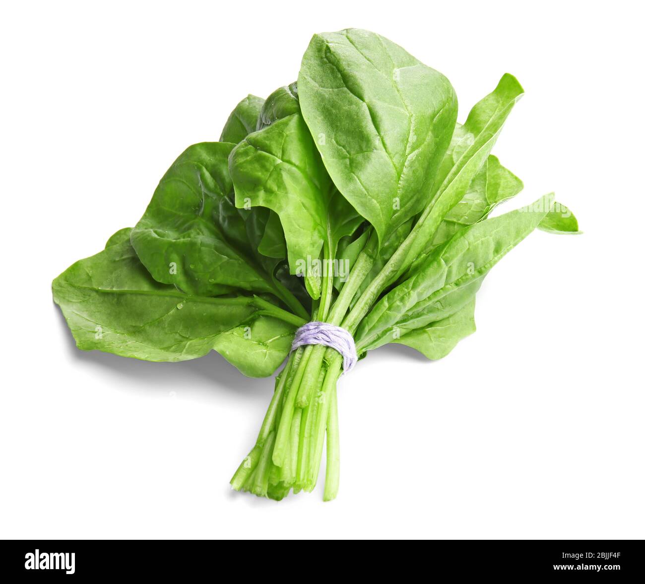Fresh bunch of spinach on white background Stock Photo - Alamy