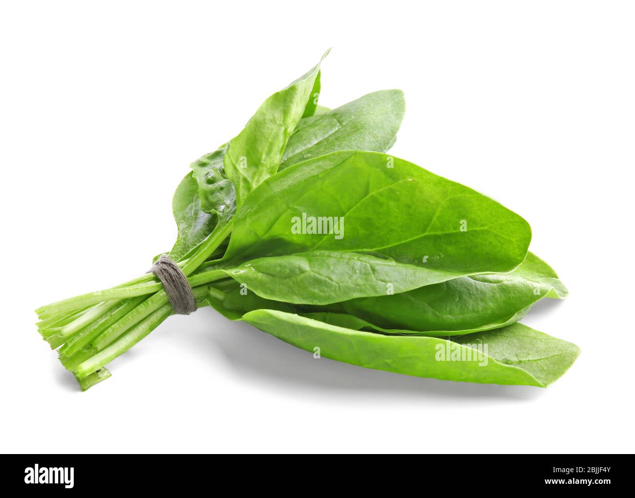 Fresh bunch of spinach on white background Stock Photo - Alamy