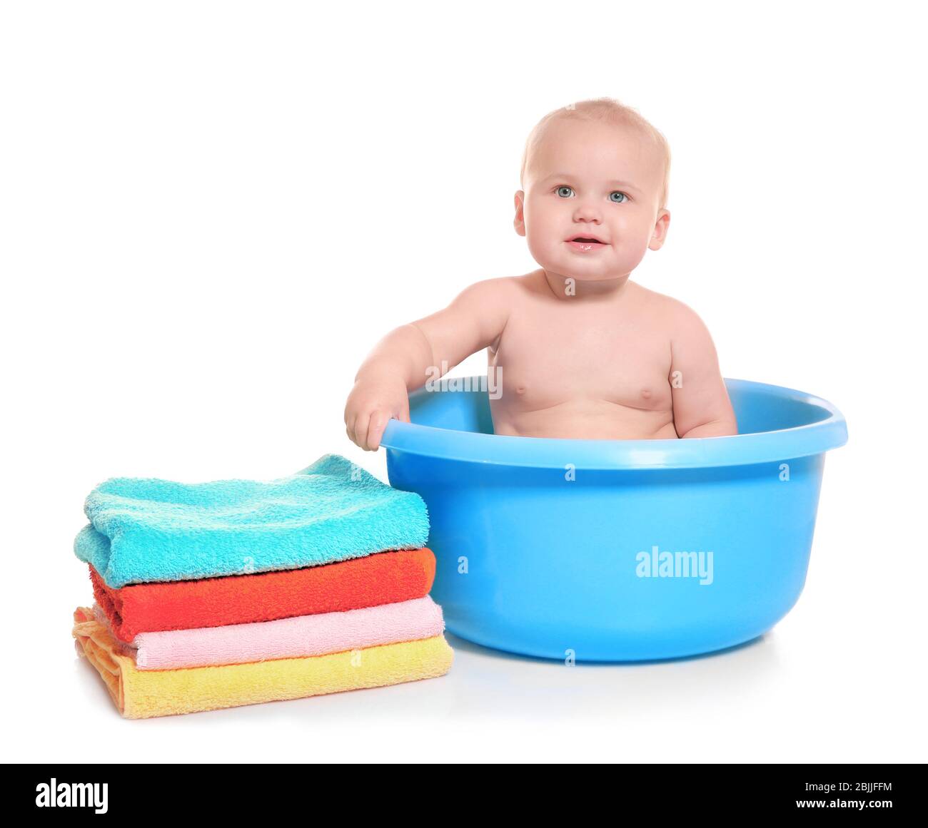 Cute baby washing in bath basin on white background Stock Photo - Alamy