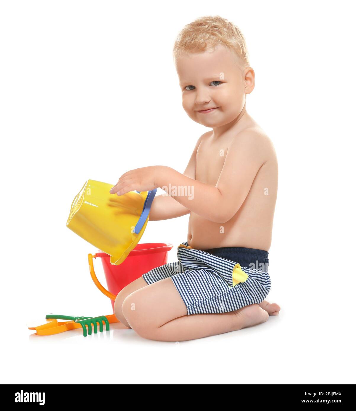 little boy in swim trunks