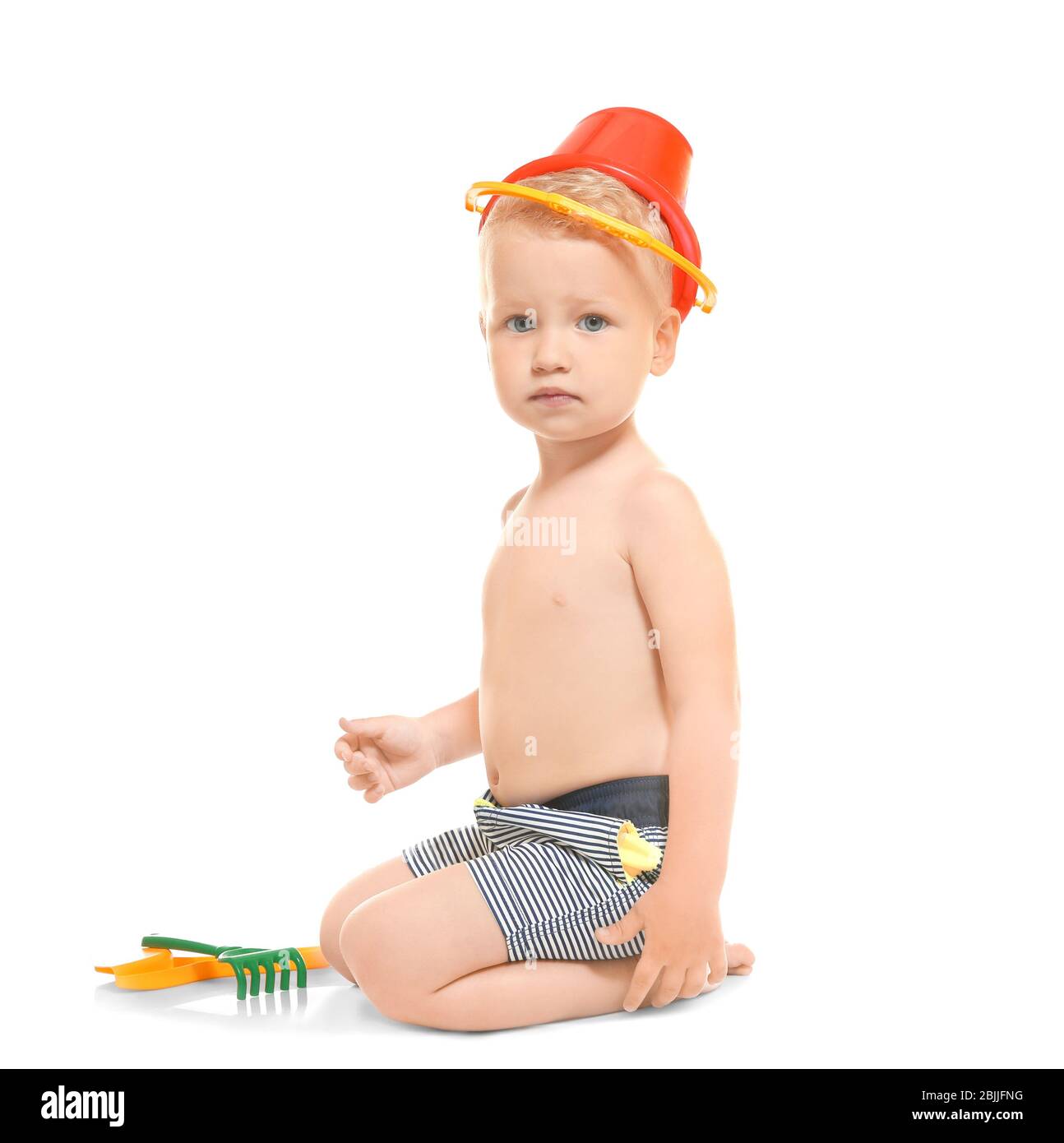 little boy in swim trunks