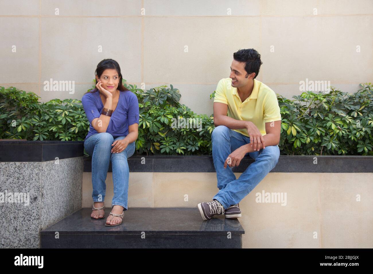 Couple sitting outside Stock Photo
