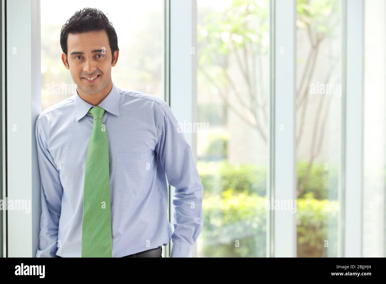 Portrait of an executive smiling Stock Photo - Alamy