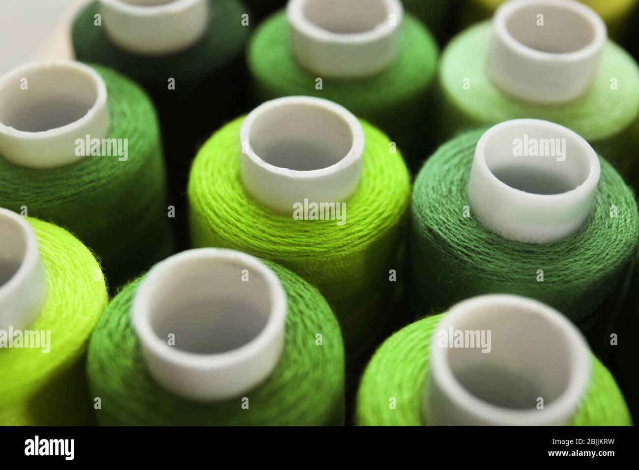 Green sewing threads of different shades Stock Photo Alamy
