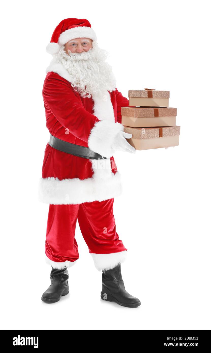 Happy authentic Santa Claus holding a pile of gift boxes on white ...