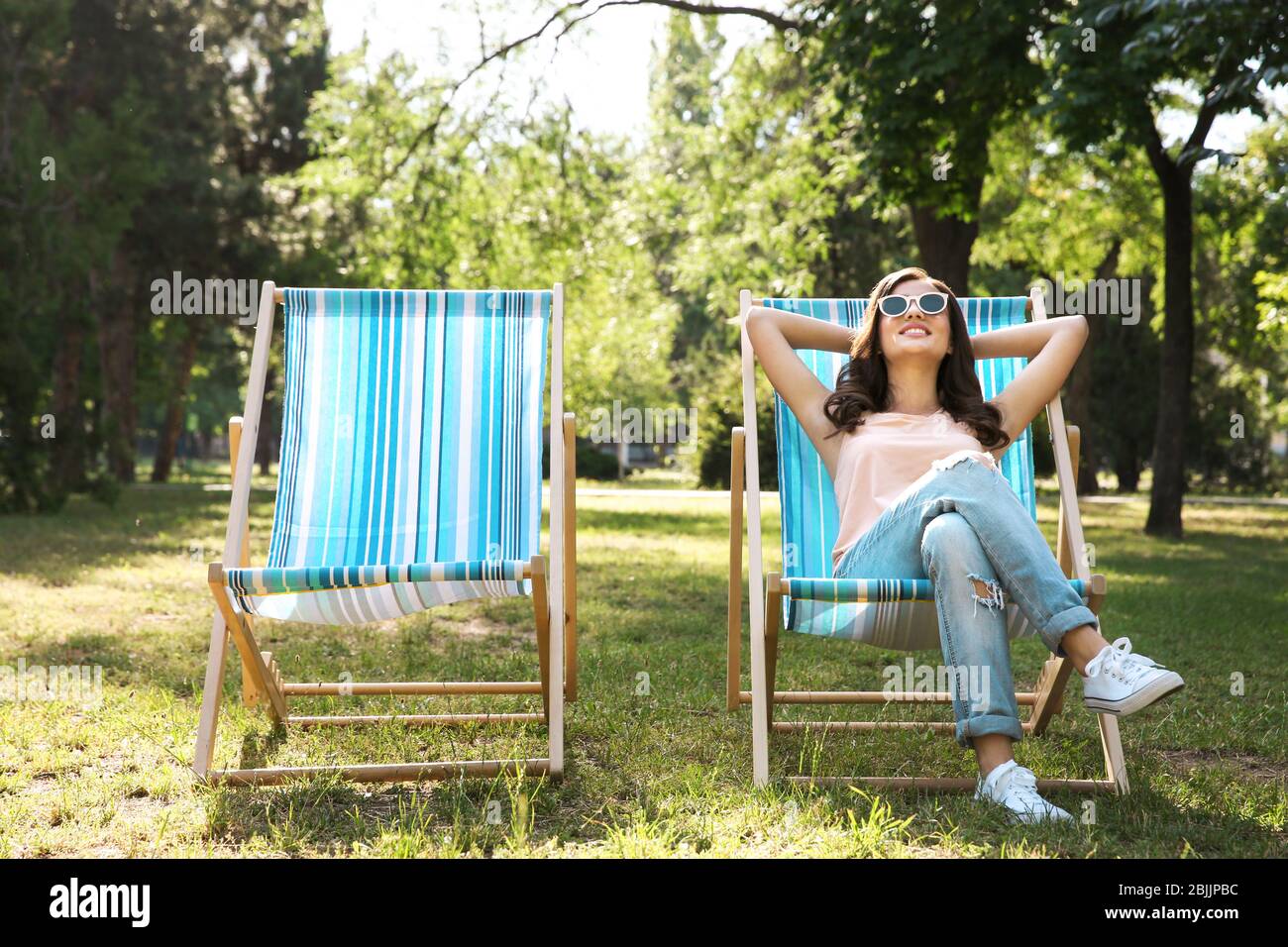 Woman In Deck Chair Sunbathing Hi-res Stock Photography And Images - Alamy