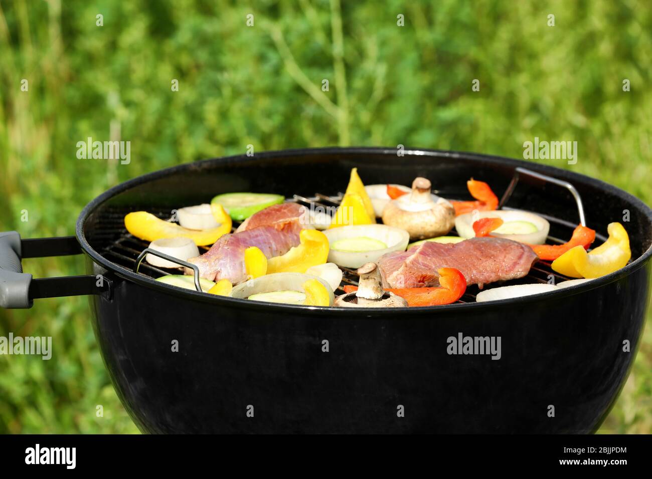 Barbecue grill with meat and vegetables outdoors, close up Stock Photo ...