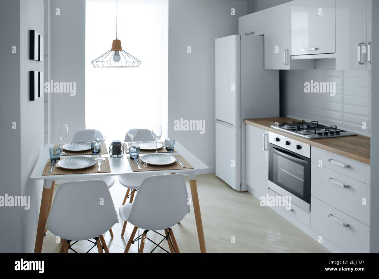 Interior of light modern kitchen Stock Photo - Alamy