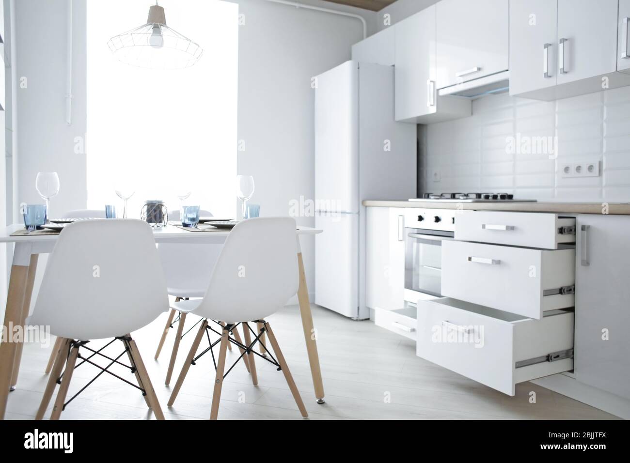 Interior of light modern kitchen Stock Photo - Alamy