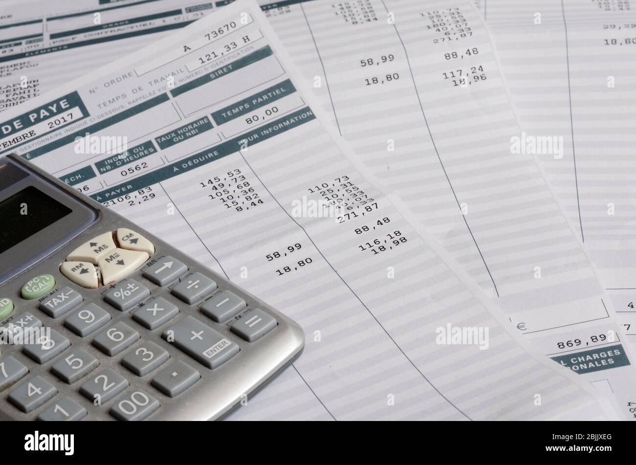 Euro Pay slip and calculator, close up for payroll or salary background,  french mention Net to pay Stock Photo - Alamy