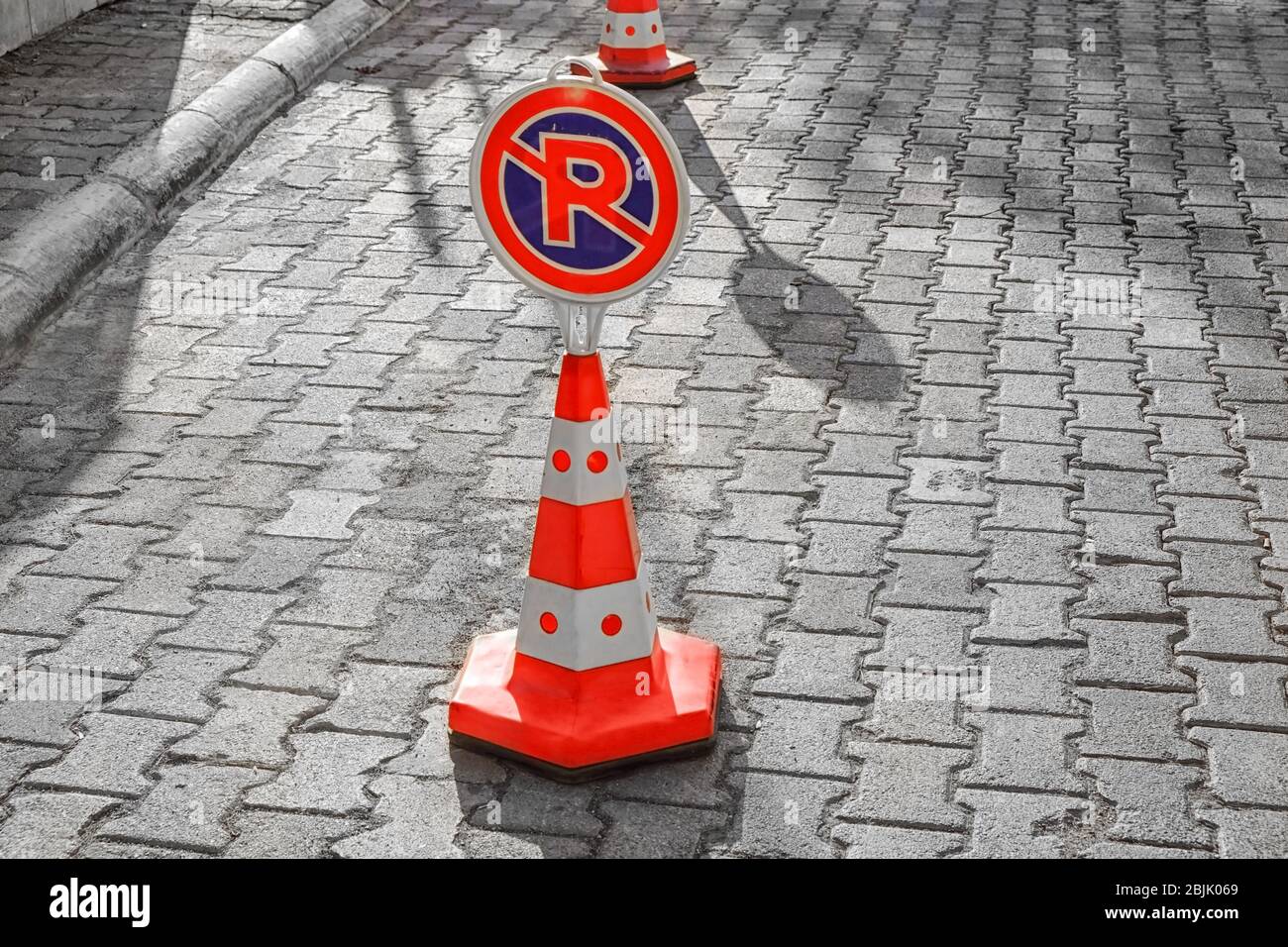 No parking sign on sidewalk Stock Photo - Alamy