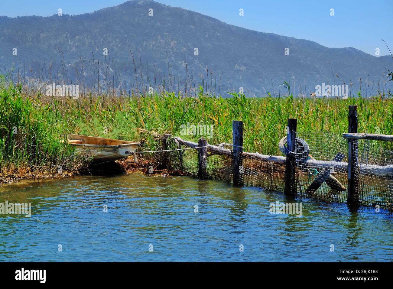 Old boat on river bank hi-res stock photography and images - Alamy