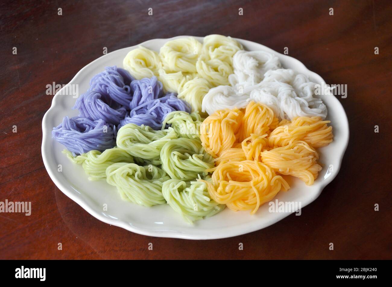 Khanom chin are fresh rice noodles in Thai cuisine which are made from rice. Stock Photo