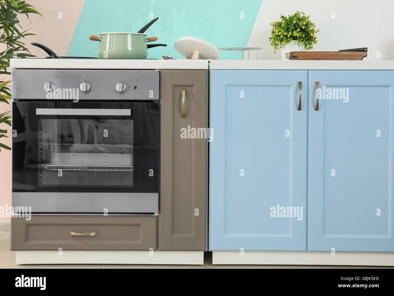 Modern kitchen furniture with electric stove Stock Photo - Alamy