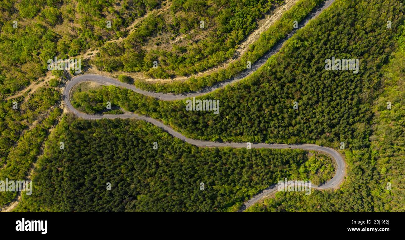 Aerial view from drone to the road through mountain Stock Photo - Alamy