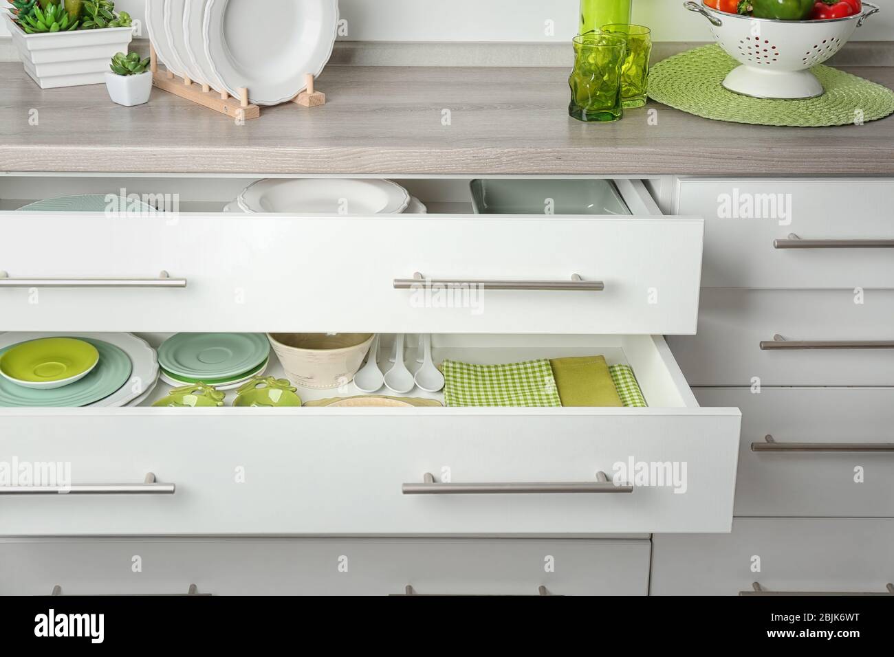 Drawers with different kitchenware Stock Photo - Alamy