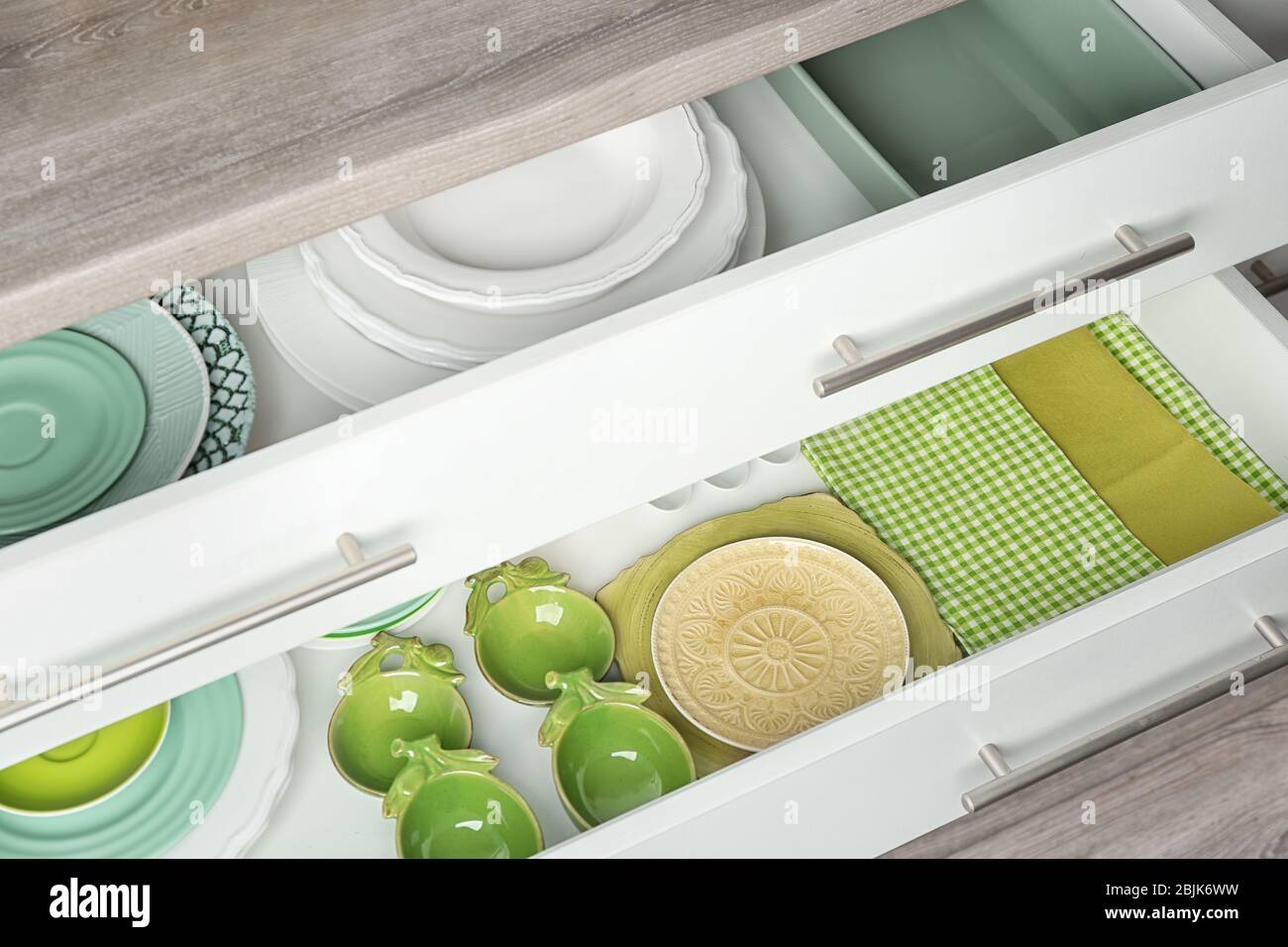 Drawers with different kitchenware Stock Photo - Alamy