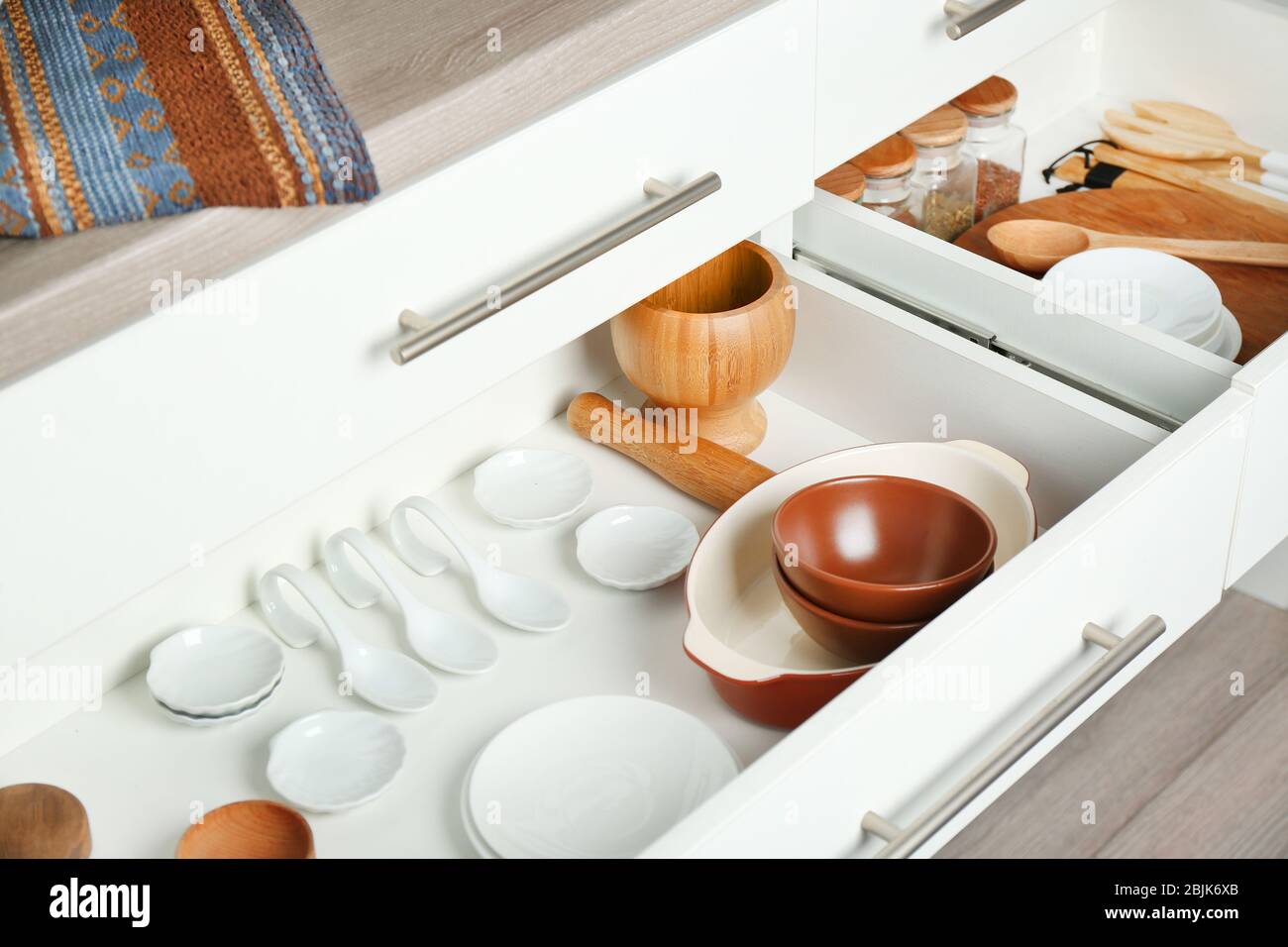 Drawers with different kitchenware Stock Photo - Alamy
