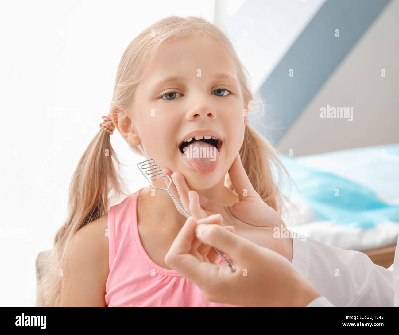 Cute girl at speech therapist's office Stock Photo