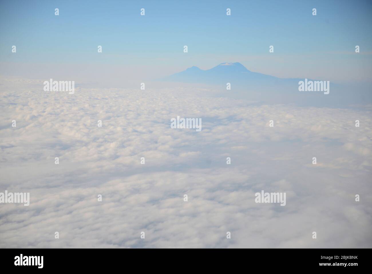 Mount Kilimanjaro above the clouds Stock Photo