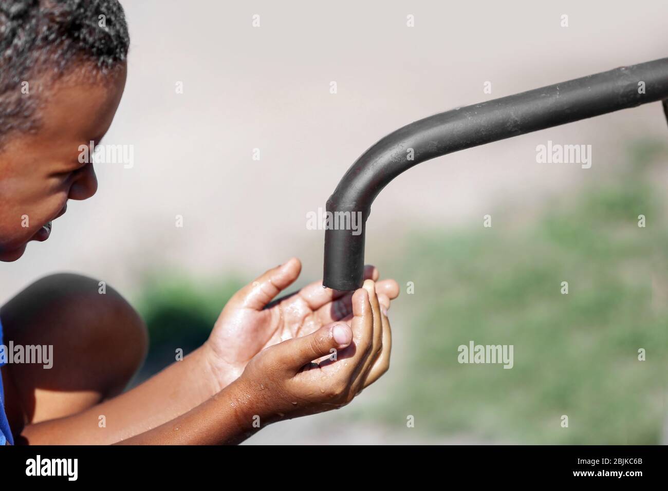 African child drinking dirty water hires stock photography and images