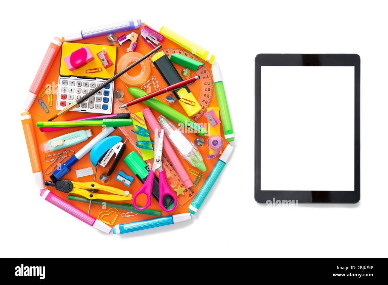 E-learning online learning with tablet PC and school supplies isolated on white. Stock Photo
