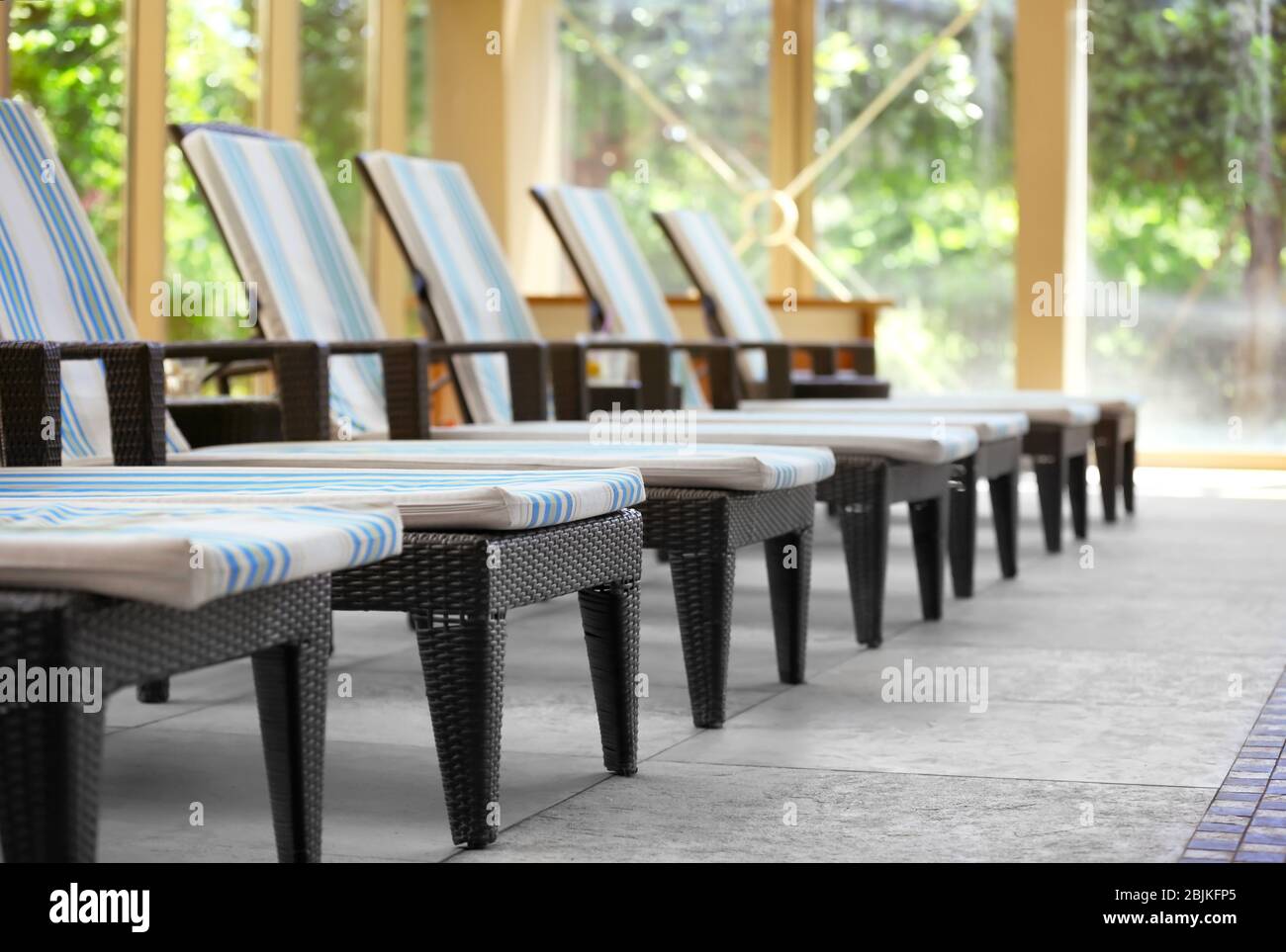 Chaise lounges in luxury hotel Stock Photo Alamy