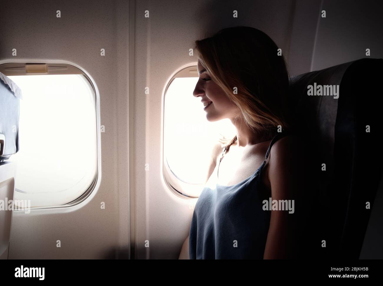 One woman flight window hi-res stock photography and images - Alamy