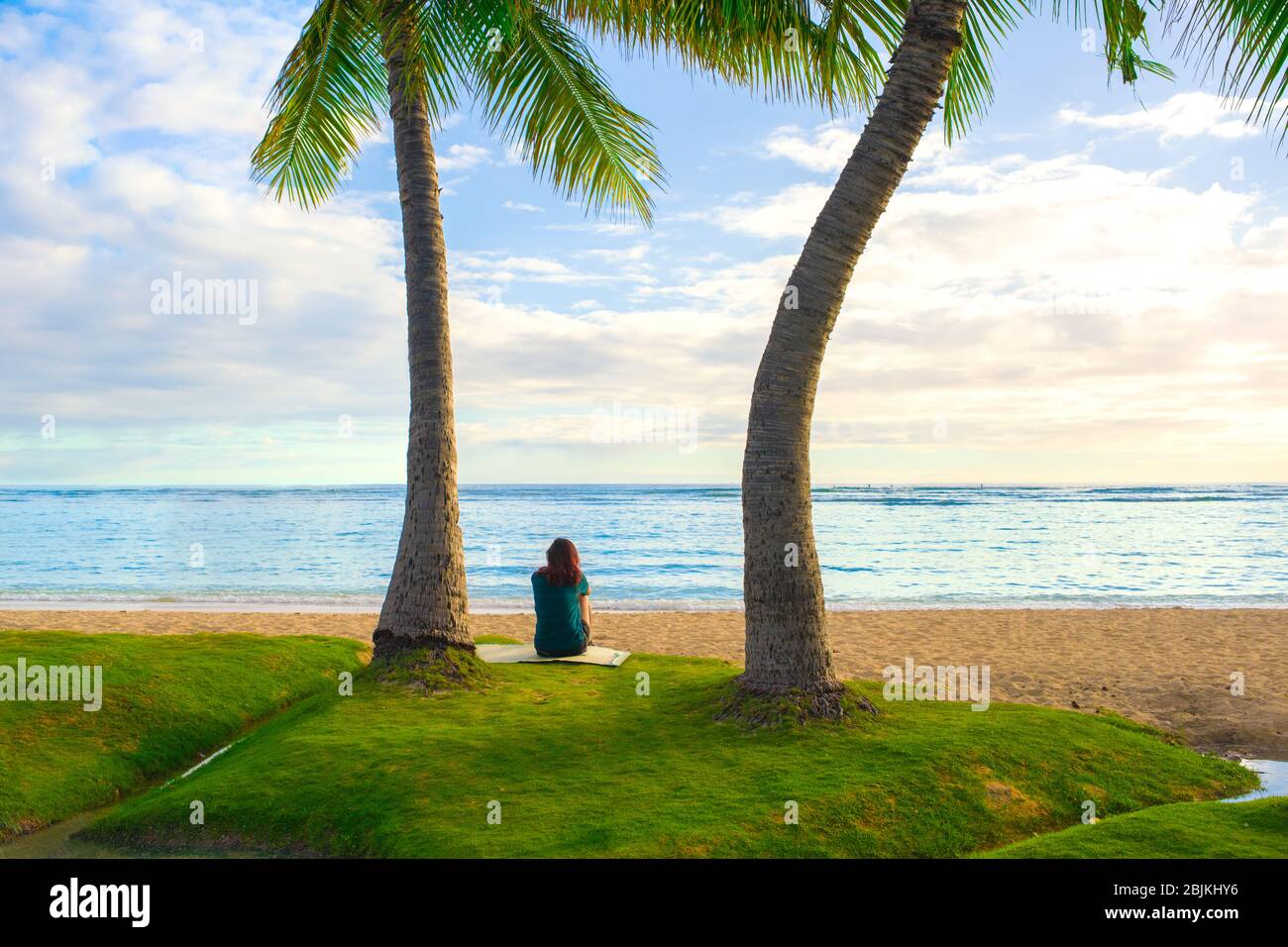 Female sitting on beach alone hi-res stock photography and images - Alamy
