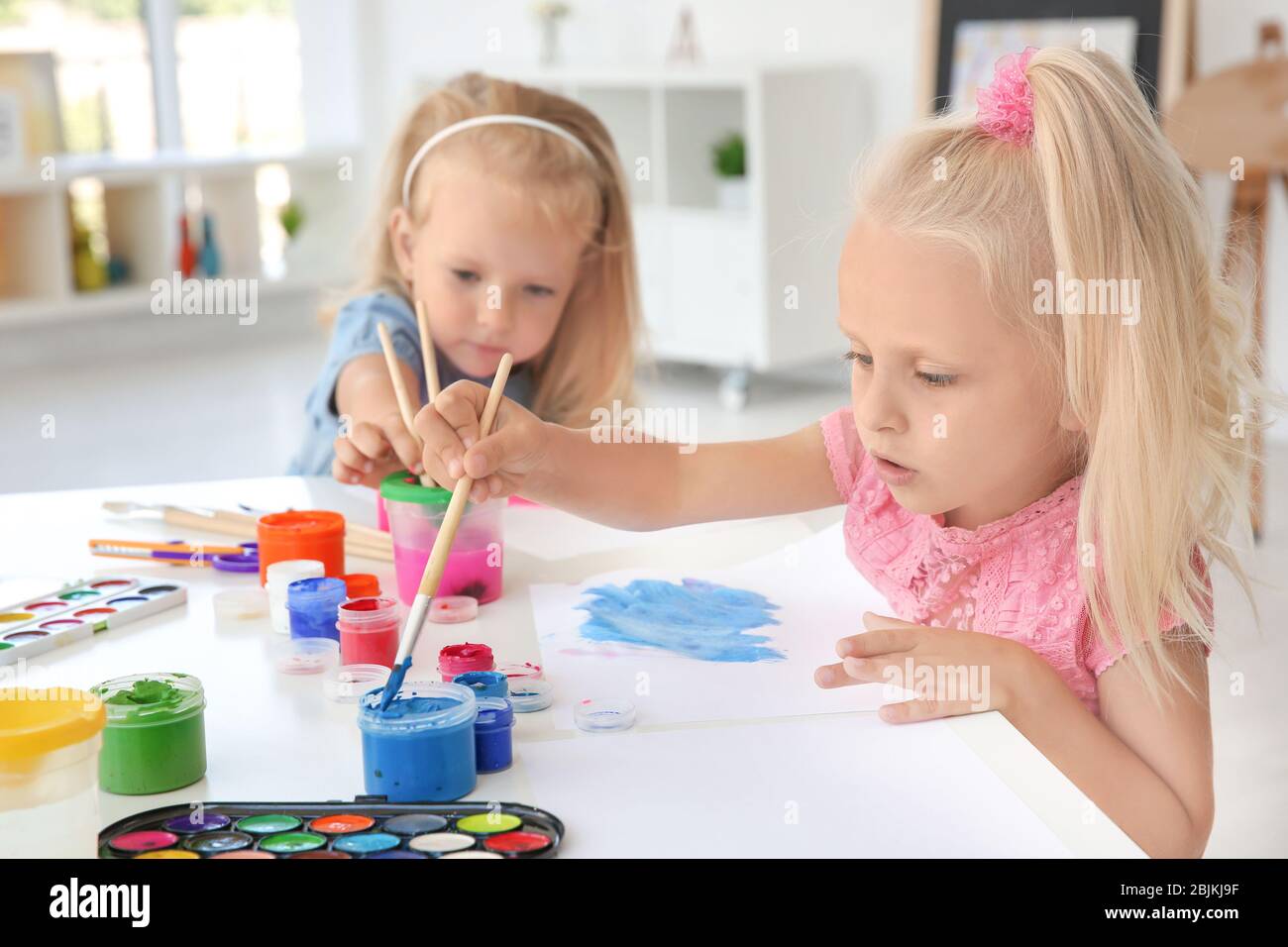 Children at painting lesson in classroom Stock Photo - Alamy