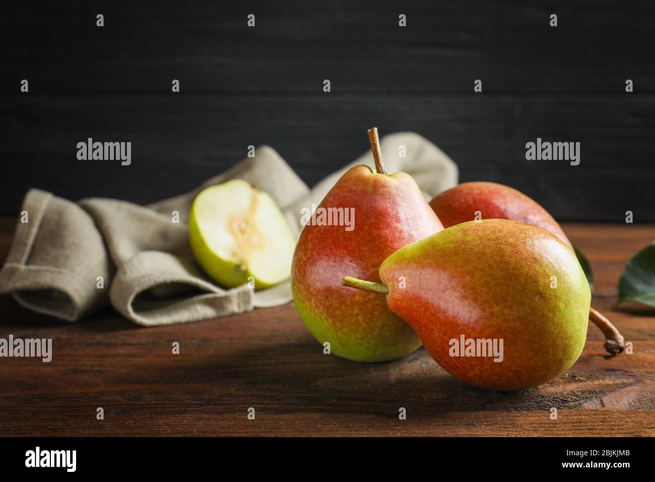 Delicious ripe pears on table Stock Photo - Alamy