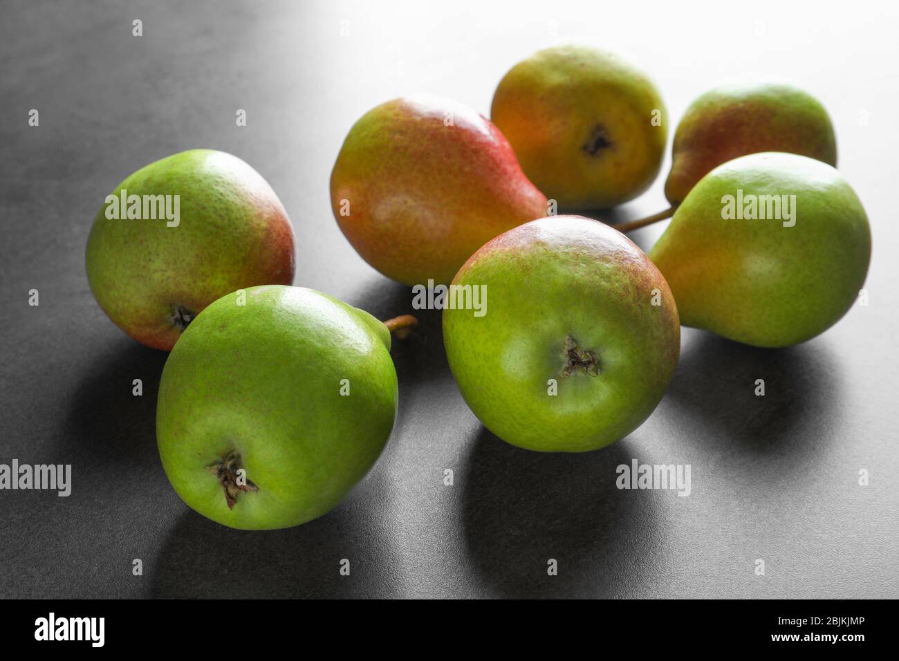 Delicious ripe pears on grey background Stock Photo - Alamy