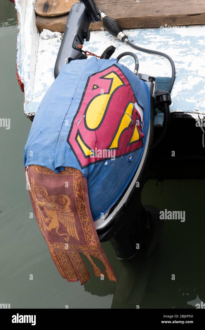 A superman cover on a motor on a boat in Venice, Italy. Stock Photo