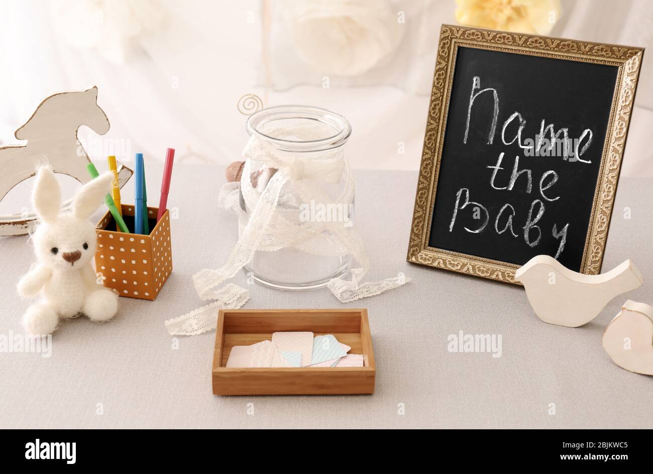 Game for suggestion of baby name on table at shower party Stock Photo
