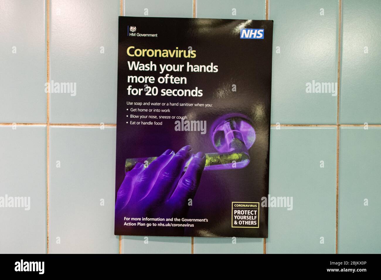 Coronavirus UK Wash your hands NHS message on poster at Glasgow University, Scotland, UK Stock Photo