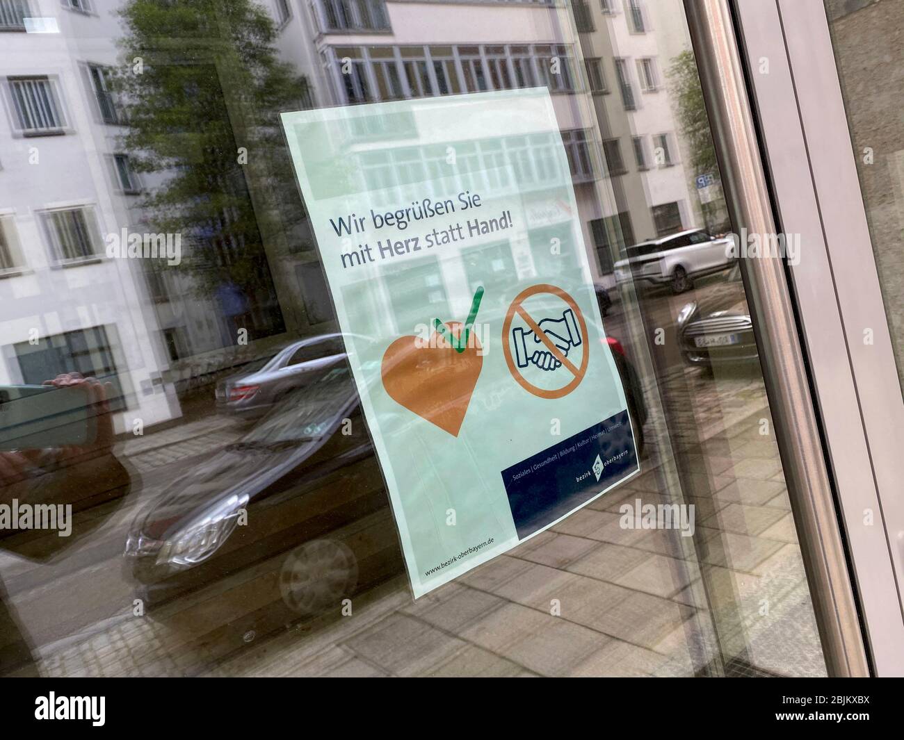 Munich. 29th Apr, 2020. Public life in times of the coronavirus pandemic on April 29, 2020 in Munich. There is a note in the glass entrance door: WE WELCOME YOU WITH HEART INSTEAD OF HAND! Compliance with the distance rule. | usage worldwide Credit: dpa/Alamy Live News Stock Photo