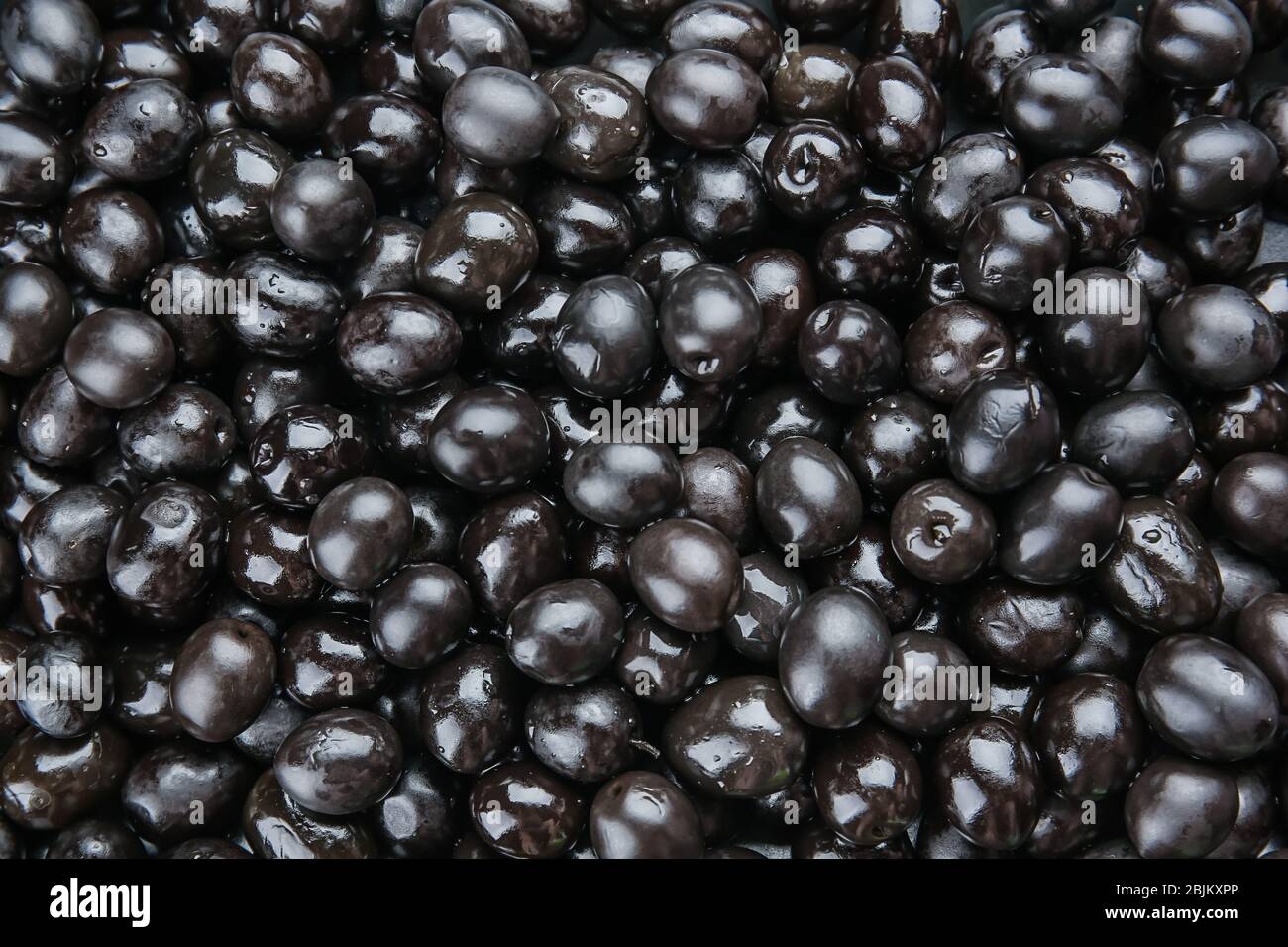 Canned black olives as background Stock Photo Alamy