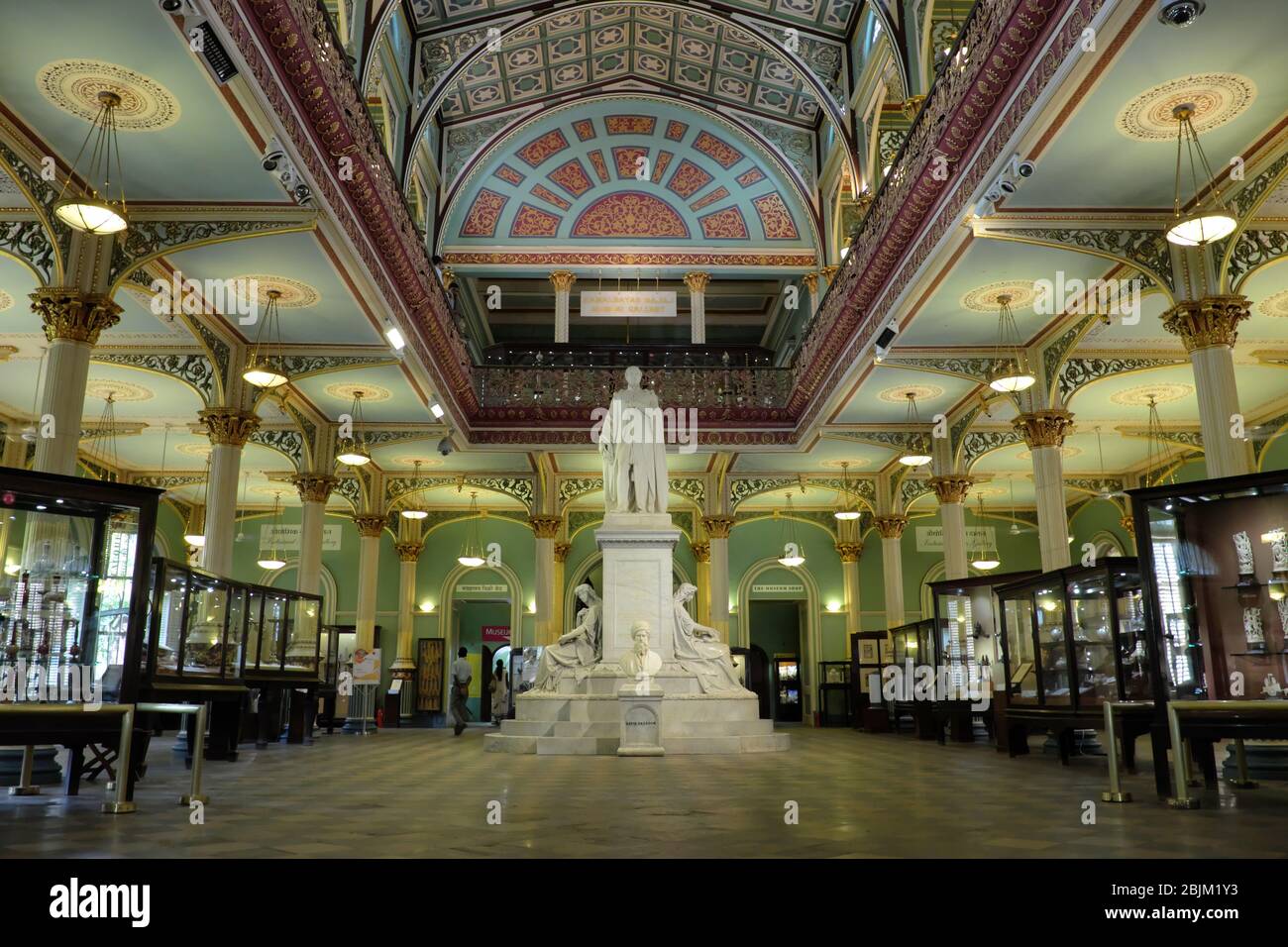 Inside view of Dr. Bhau Daji Lad Museum in Mumbai, India, with a statue of Prince Albert in the center and in front of it a bust of David Sassoon Stock Photo