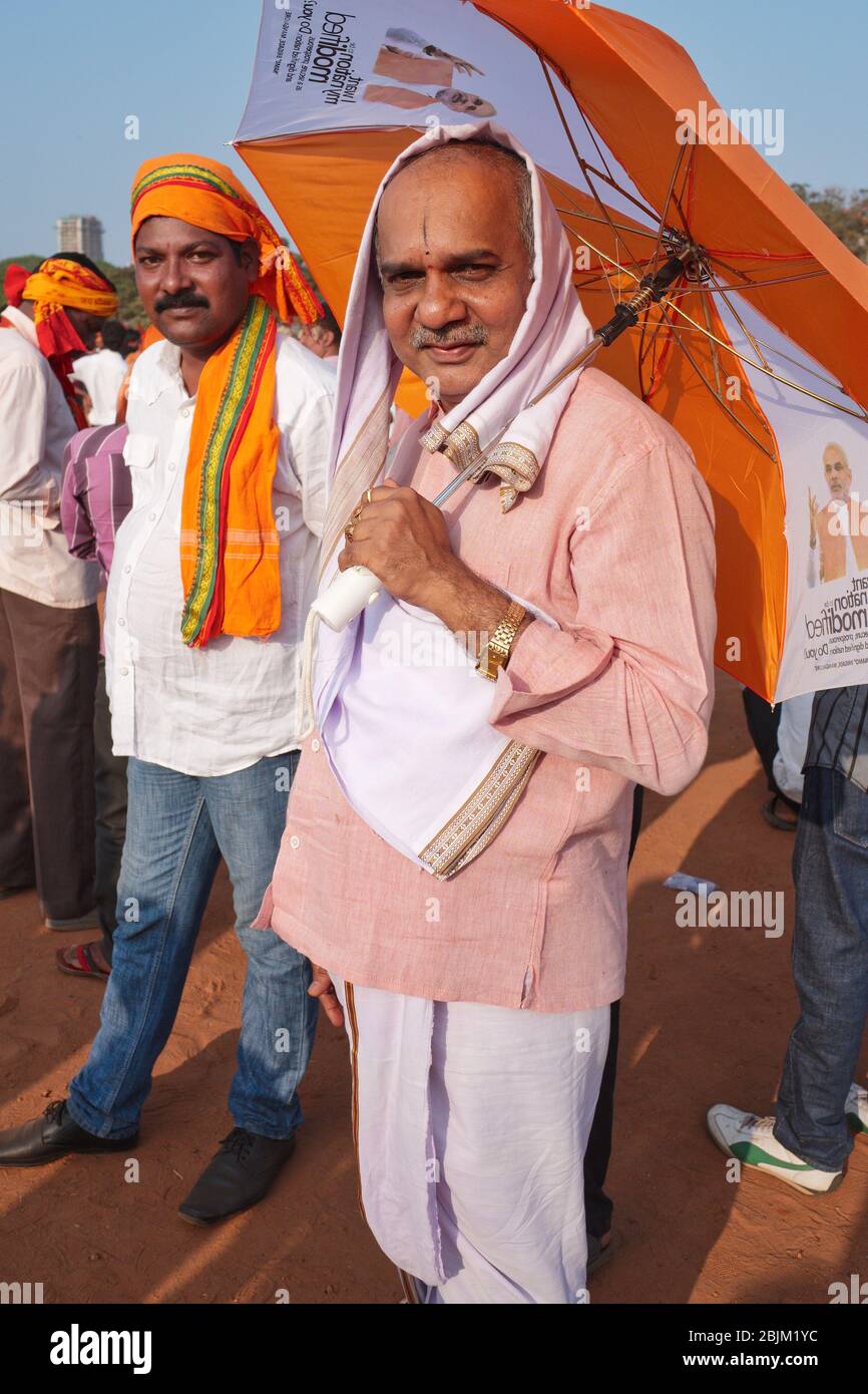 Members of the BJP (Bharatiya Janata Party) wearing the traditional Hindu color saffron, during an election campaign in Mangalore, Karnataka, India Stock Photo